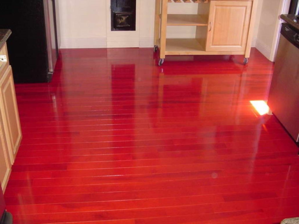 shinyredhardwoodfloorcolorinkitchenareaequippedwithcart